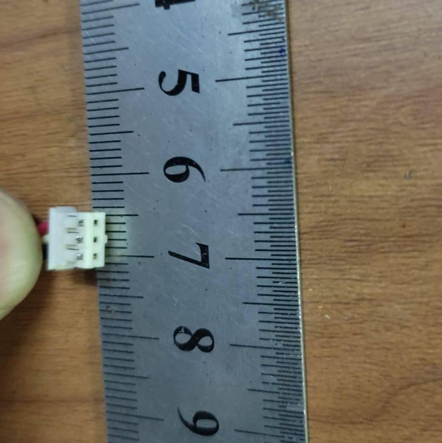 3 Pin Connector With 6 Inch Length Wire 2mm pitch 2mm distance between 2 pins - shown in a close-up view being measured against a metal ruler to display its 2mm pitch.