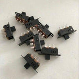 3 Pole 3 Position Slide Switch 6 Pin Lever Switch Handle High Miniature - collection of black miniature slide switches with six metal pins and a sliding lever handle arranged on a white surface.