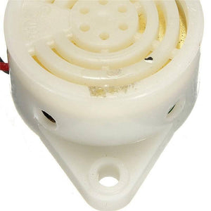3 To 24V Electronic Buzzer Beep Alarm Sfm-27 - a close-up of a white, circular plastic buzzer with a mounting tab and a speaker grill on top.