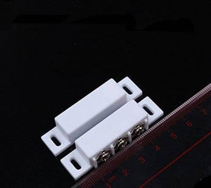 3 Wire No Nc Magnetic Reed Sensor Signal Switch For Door Access Control - shown as two white rectangular units with three screw terminals next to a ruler.