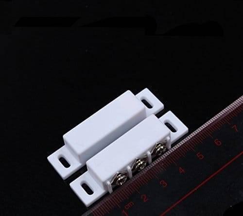3 Wire No Nc Magnetic Reed Sensor Signal Switch For Door Access Control - shown as two white rectangular units with three screw terminals next to a ruler.