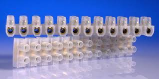 30 Amp Connector Strip, 12 Way PVC - shown as a translucent white plastic block with twelve metal screw terminals, arranged in two stacked rows.