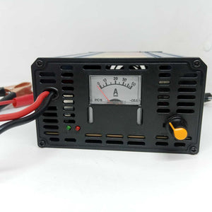 30A 12V Battery Charger Ma-1230 - a black rectangular unit with an analog ammeter, a yellow control knob, a red indicator light, and red and black cables.