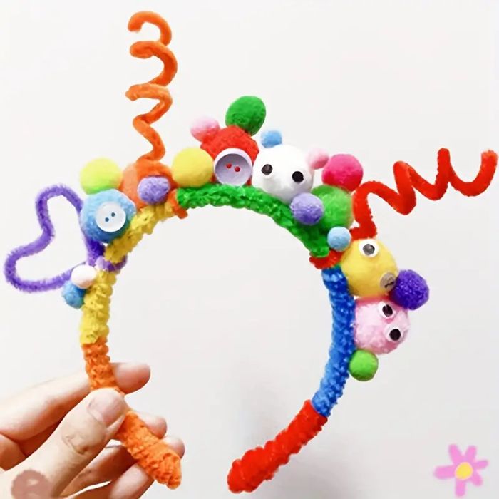 30cm Length Randomly Bended Polyester Hair Root Hair Strip Twist Sticks - fashioned into a colorful, decorative headband adorned with pom-poms and buttons.