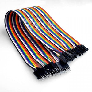 30cm Pin To Hole Arduino Jumper Wire Dupont - a bundle of multi-coloured ribbon cables with black female-to-male connectors at each end.