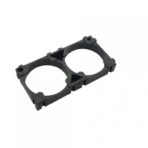 32140 Lithium Cell Holder Bracket - Dual Cell Spacer - a black plastic rectangular frame with two circular openings for housing batteries.