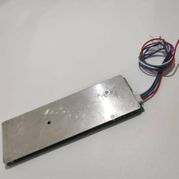 32650 Cell 4s BMS 100A 12V Battery Charging Module Cf 12V100TA a PCB Protection Board - a rectangular green circuit board with a silver metal heat sink and a multi-colored wire harness.