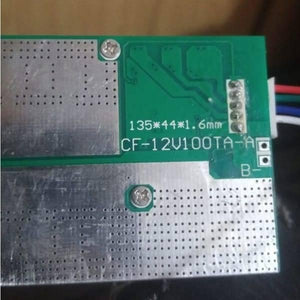 32650 Cell 4s BMS 100A 12V Battery Charging Module Cf 12V100TA a PCB Protection Board - a close-up of a green rectangular circuit board with a silver metal plate and a five-pin connector.