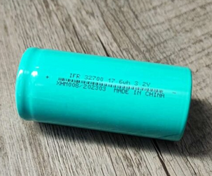 32700 3.2V 4000mAh LiFePO4 Battery - shown as a single teal cylindrical cell with printed technical specifications and a barcode on its side.