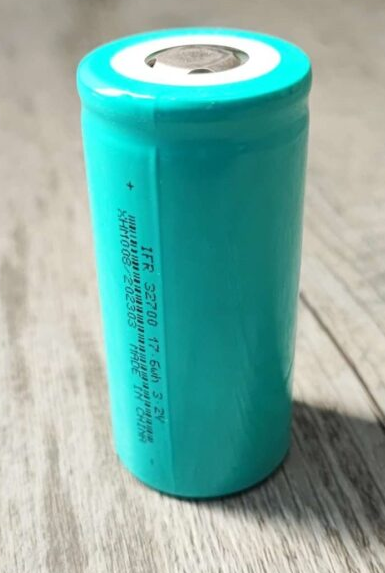 32700 3.2V 4000mAh LiFePO4 Battery - shown as a single, cylindrical, teal-coloured battery cell with text printed on its side.