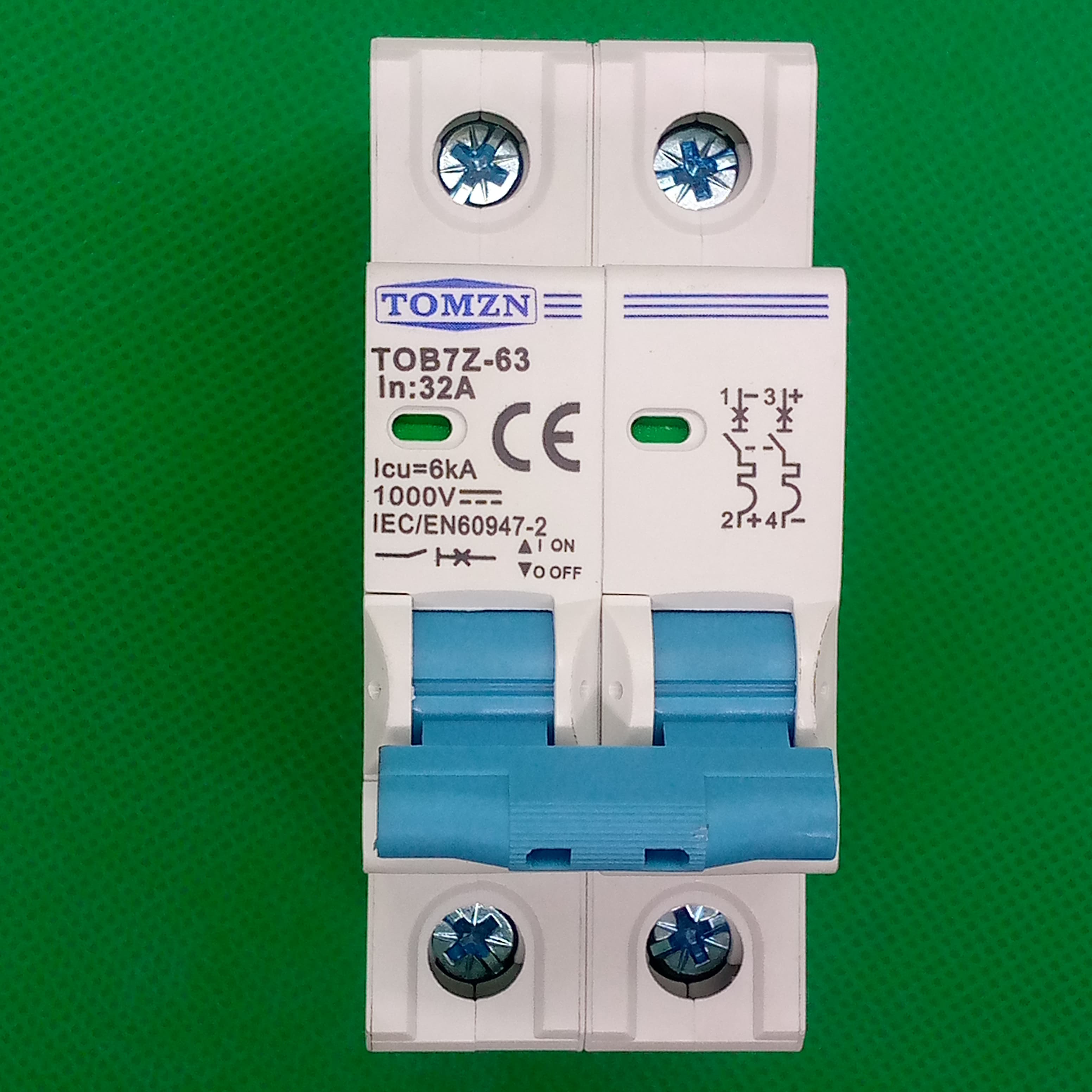 32A Tomzn Tob7z-63 2p DC 1000V Solar Circuit Breaker - Reliable Protection For Solar System - a white two-pole electrical switch with blue toggles, terminal screws, and printed technical specifications.