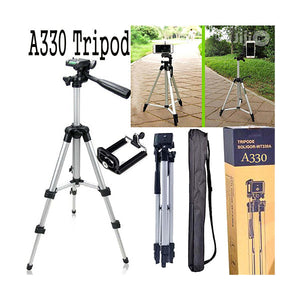 330A Tripod Mobile + Camera Stand Professional Stand For Tik Tokers & Youtubers - a silver camera stand, phone holder attachment, folded tripod, carrying case, and retail box showing the tripod in use.
