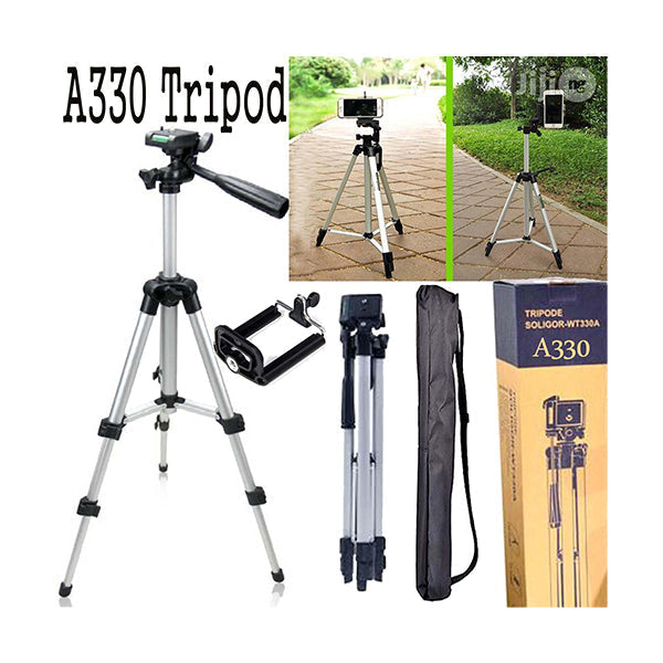 330A Tripod Mobile + Camera Stand Professional Stand For Tik Tokers & Youtubers - a silver camera stand, phone holder attachment, folded tripod, carrying case, and retail box showing the tripod in use.