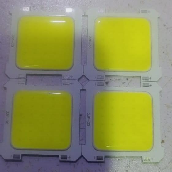 33F-30 COB LED - four square yellow LED chips on white circuit boards arranged in a two-by-two grid, each with visible positive and negative terminals.