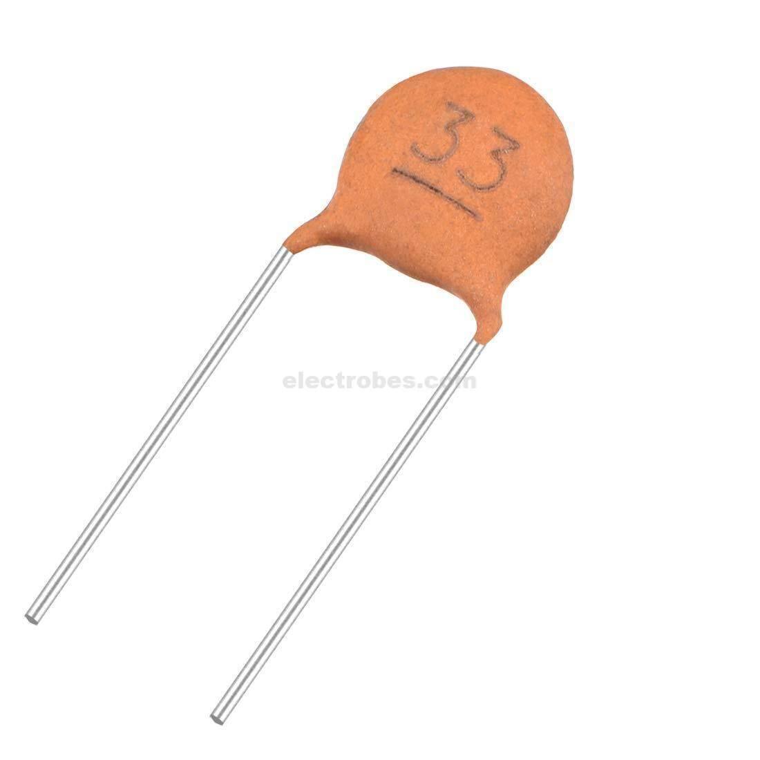 33pF Capacitor - a small brown disc-shaped ceramic capacitor with two long metal wire leads extending from the bottom.