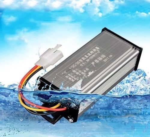 36V 48V 72V 120V To 12V 10A DC To DC Converter Adapter Step Down Regulator - a rectangular silver metal box with a three-wire connector cable, shown submerged in water.