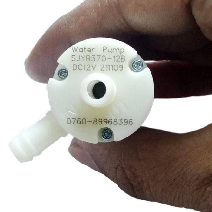 370-12B Micro Water Pump 12V DC High Quality - a white plastic pump held in a hand, showing the outlet port and text including the model number and voltage.