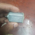 390PA DC Motor - shown in a hand, featuring a silver cylindrical metal body with a small rotating shaft and visible model text printed on the side.
