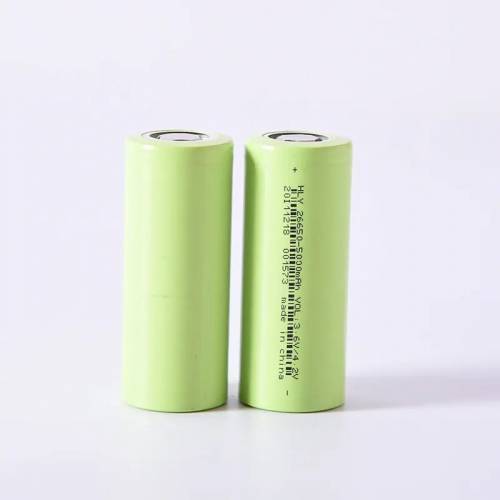 3c Discharge Hly Ncm 26650 5Ah 5000mAh Lithium Ion Battery Cell For E-bike Battery Pack - two cylindrical light green batteries standing upright, one showing printed technical specifications and a barcode.