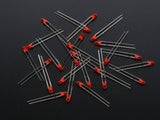 3mm Red LED - a scattered pile of small, round, red-colored light-emitting diodes with two metallic leads each, set against a dark background.