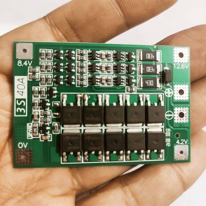 3s 40A BMS 11.1V 12.6V 18650 Lithium Battery Protection Board With 100mA Balancing Feature - a rectangular green circuit board with ten MOSFETs, resistors, and labeled connection pads for 0V to 12.6V.