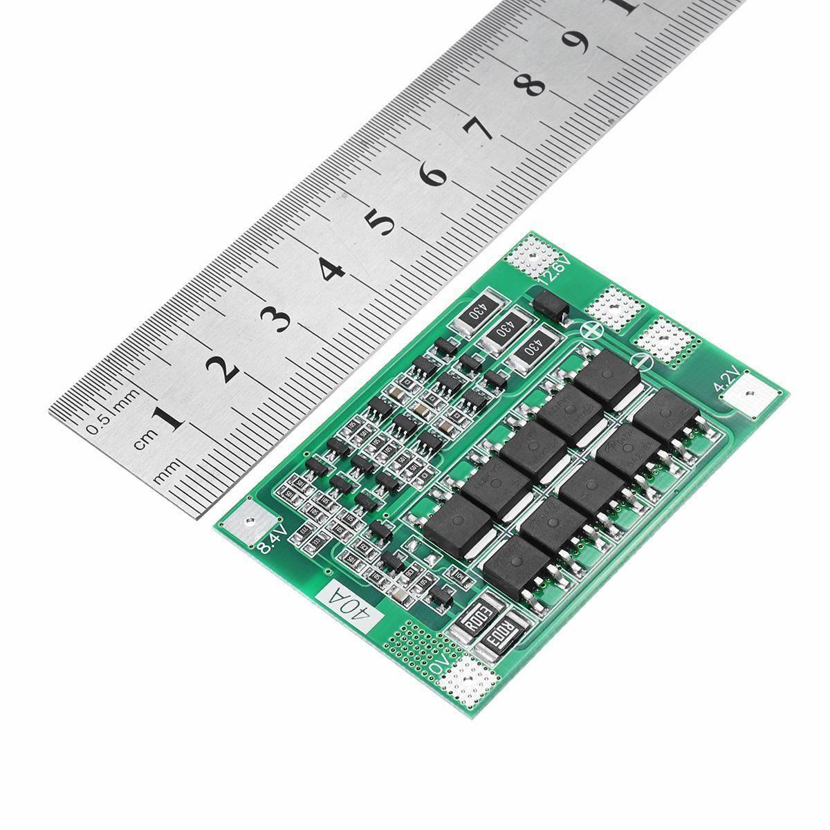 3s 40A BMS 11.1V 12.6V 18650 Lithium Battery Protection Board With 100mA Balancing Feature - shown next to a metal ruler to indicate its dimensions.