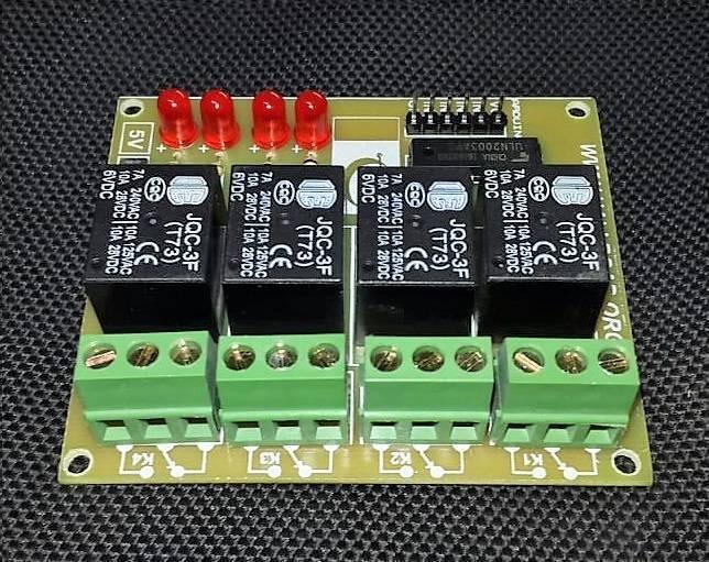 4 Channel Relay Module Relay Board Arduino Relay Module - a green circuit board featuring four black JQC-3F relays, four red LEDs, green screw terminals, and a black header connector.