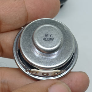 4 Ohm 3 Watt Speaker - a close-up view of the back of a small round silver speaker with two metal contact terminals and "MY 4Ω3W" printed on the magnet.