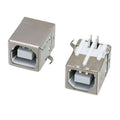 4 Pin USB b Type Socket Connector - shown as two silver metal components with white plastic internal ports, viewed from the front and rear angles.