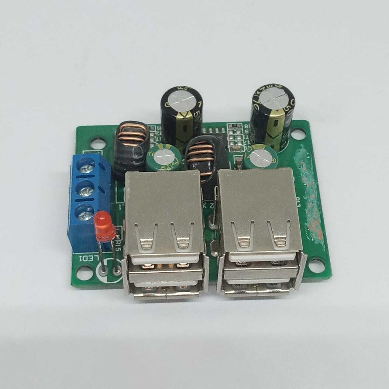 4 USB Port A5268 Chip Step Down Transformer Converter Board Module DC 12V 24V 40V To 5V 5A 25W For MP3/MP4 Phone Car Equipment - a green circuit board with four USB ports, two inductors, capacitors, and a blue terminal block.