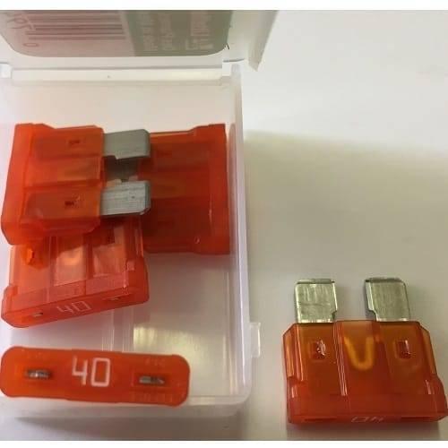 40 Amp Plug In Automotive Auto Fuse Car Fuse - orange plastic fuses with metal terminals inside a clear plastic storage box and one placed outside.