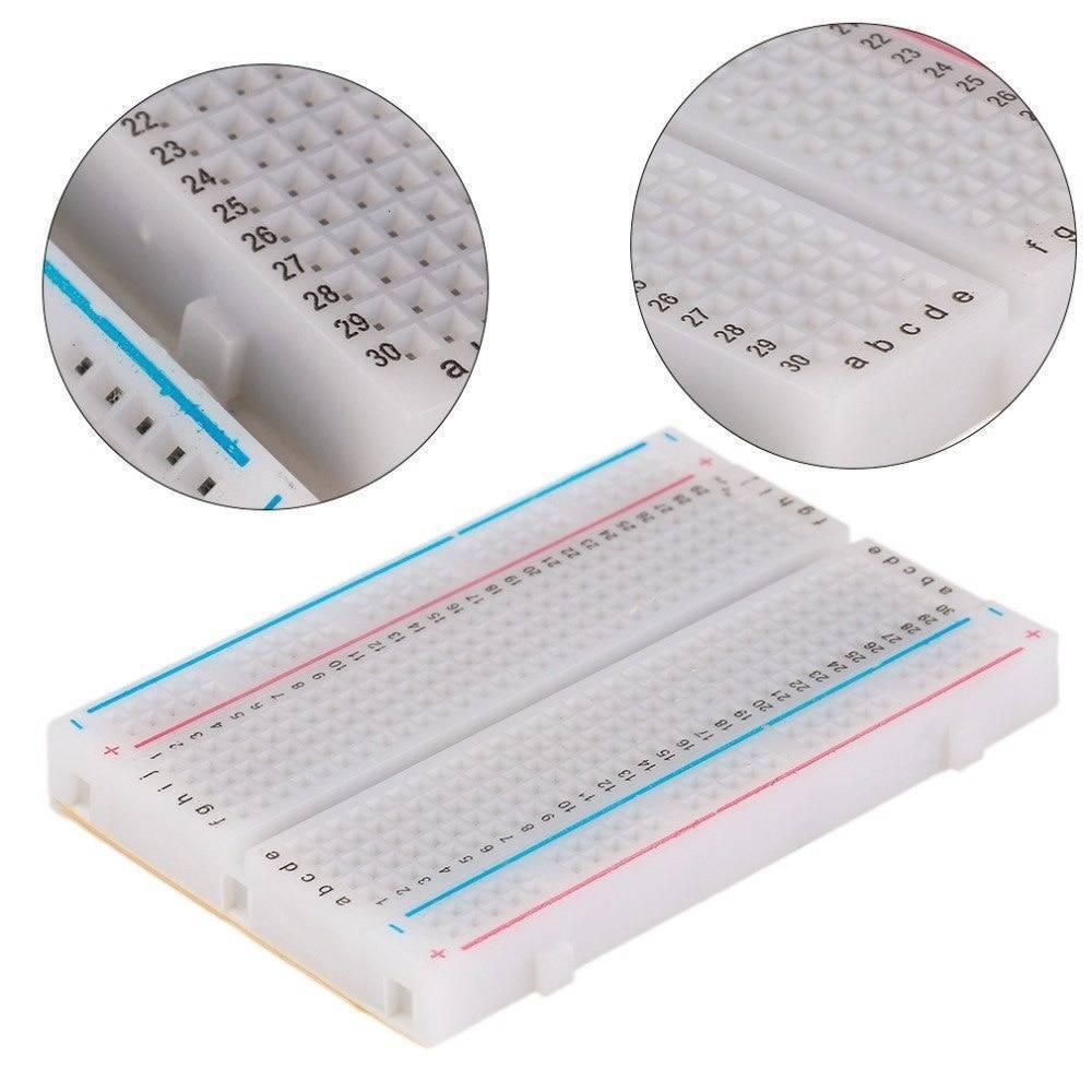 400 Tie Points Half Size Solderless Breadboard Solder Less Breadboard Prototyping Board - a white rectangular prototyping board with numbered rows and two circular close-up insets.
