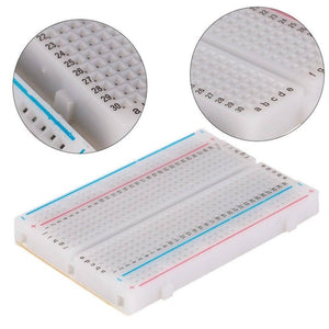 400 Tie Points Half Size Solderless Breadboard Solder Less Breadboard Prototyping Board - a white rectangular prototyping board with numbered rows and two circular close-up insets.