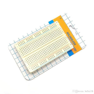 400 Tie Points Half Size Solderless Breadboard Solder Less Breadboard Prototyping Board - a white rectangular prototyping board with numbered rows and lettered columns, shown in its retail packaging.