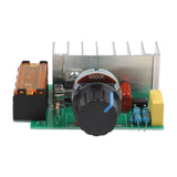 4000W AC SCR Voltage Regulator – 0-220V Motor Speed Controller With Temperature Protection - a green circuit board, a large silver heatsink, a black B500K rotary knob, and an orange terminal block.