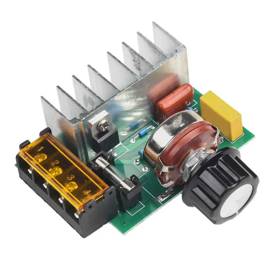 4000W AC SCR Voltage Regulator – 0-220V Motor Speed Controller With Temperature Protection - a green circuit board with a silver heatsink, a black rotary knob, a fuse holder, and a four-terminal connector.