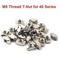 40XM5 T Slot Nut M5 Thread For 40 Series European Aluminium Profile Nickle Plated Hammer Head Type T Nut - a pile of silver, nickel-plated hammer head T-nuts with M5 threaded holes for 40 series aluminum profiles.