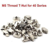 40XM5 T Slot Nut M5 Thread For 40 Series European Aluminium Profile Nickle Plated Hammer Head Type T Nut - a pile of silver, nickel-plated hammer head T-nuts with M5 threaded holes for 40 series aluminum profiles.