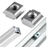 40XM6 Slot Nut Sliding Nut For 4040 Aluminum Extrusion Hammer Head Drop In Connector - two silver hammer-head nuts and an aluminum extrusion profile with one nut inserted.