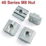 40XM8 Slot Nut Sliding Nut For 4040 Aluminum Extrusion Hammer Head Drop In Connector - 40 Series M8 Nut, showing four silver-colored, rectangular metal sliding nuts with central threaded holes, arranged on a white background.