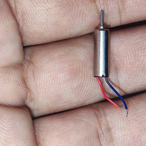 412 Coreless Motor DC3.7V Super Small Iron Boron Strong Small Motor Turn 72000 RpmCoreless Motor - silver cylindrical motor with a metal shaft and two thin red and blue wires, held in a person's palm.