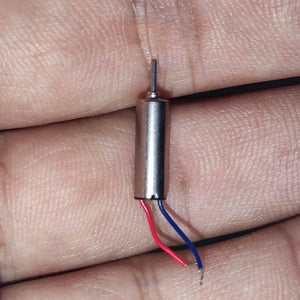412 Coreless Motor DC3.7V Super Small Iron Boron Strong Small Motor Turn 72000 RpmCoreless Motor - silver cylindrical motor with a metal shaft and two thin red and blue wires, held between fingers.