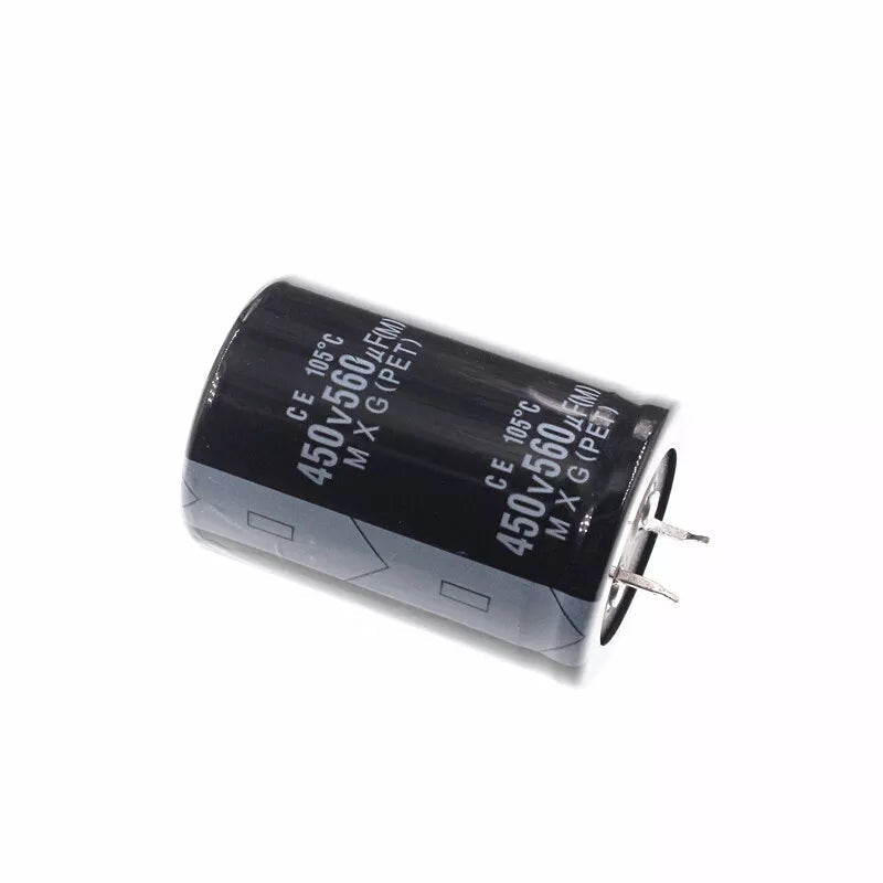 450V 560uF Capacitor - a black cylindrical electrolytic capacitor with two metal pins and printed specifications on its side, isolated on white.
