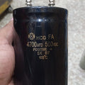 4700uF 500V Electrolytic Capacitor price - a large black cylindrical electrolytic capacitor with two screw-terminal connectors held in a hand.