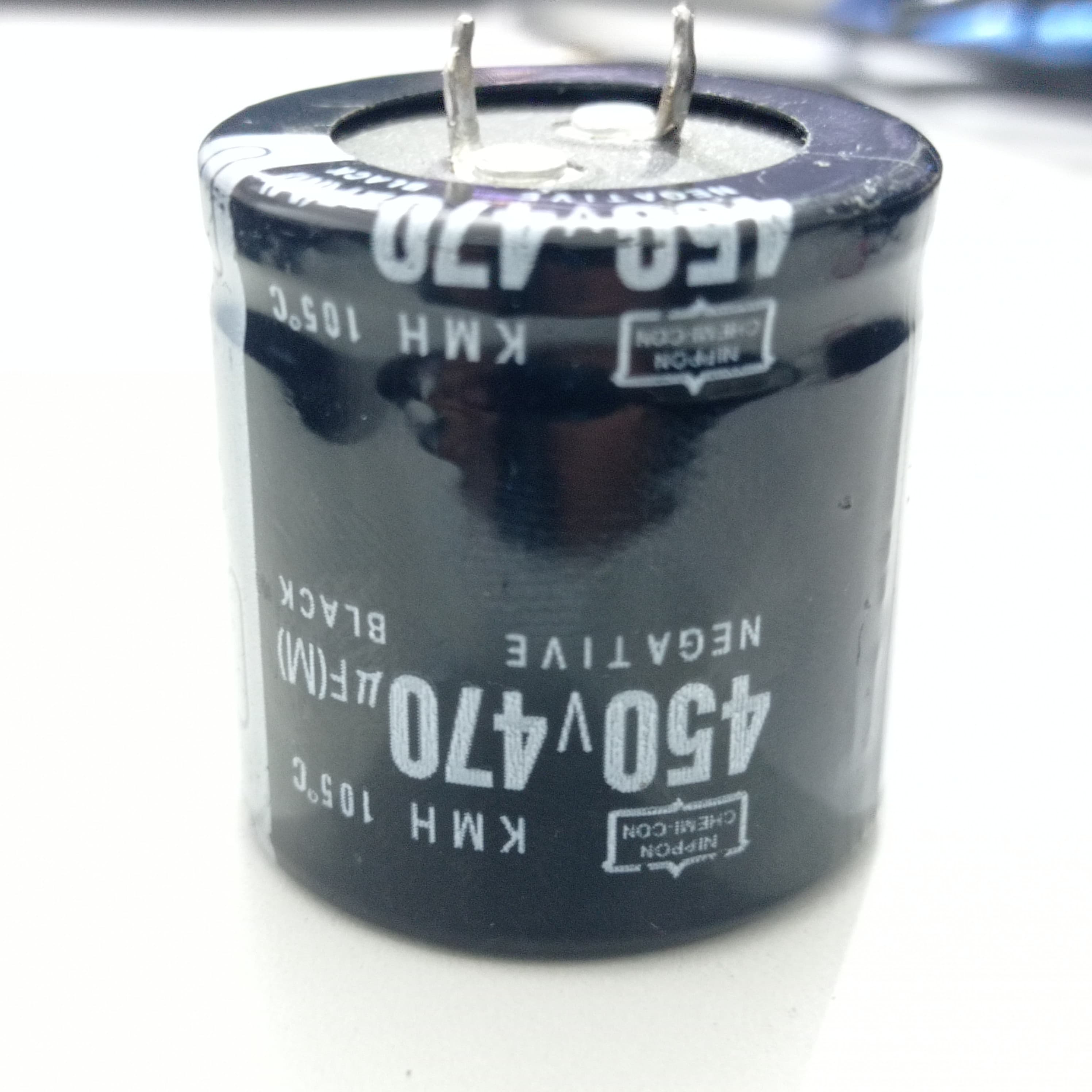 470uF 450V Capacitor - a black cylindrical electrolytic capacitor with two metal terminals on top and printed technical specifications on its side.