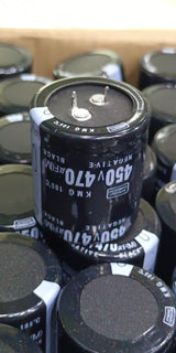 470uF 450V Capacitor For Local Inverter Manufacturing - a black cylindrical electrolytic capacitor with two top terminals, shown in a bulk storage tray.