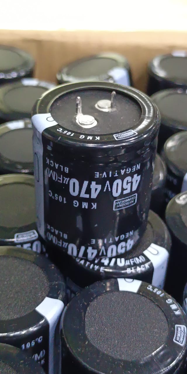 470uF 450V Capacitor For Local Inverter Manufacturing - a black cylindrical electrolytic capacitor with two top terminals, shown in a bulk storage tray.