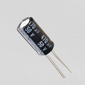 470uF 50V Capacitor Radial Electrolytic Capacitor - a black cylindrical electronic component with two metal leads and printed text reading 470µF and 50V.
