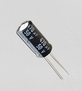 470uF 50V Capacitor Radial Electrolytic Capacitor - a black cylindrical electronic component with two metal leads and printed text reading 470µF and 50V.