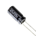 47uF 25V Polar Capacitor - a black cylindrical electrolytic capacitor with two wire leads, showing the text "47µF25v" printed on its side.